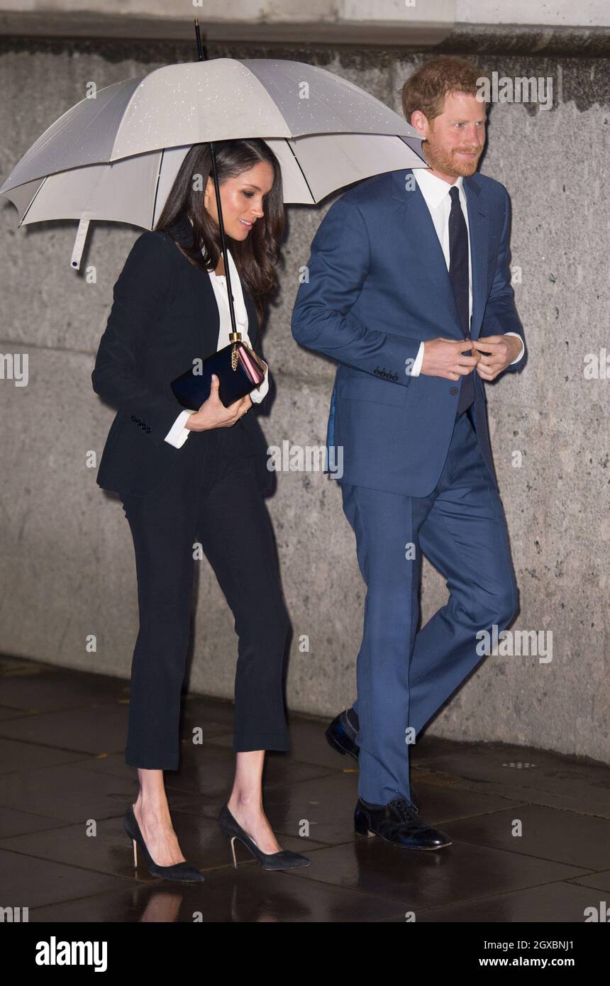 Prince Harry and Meghan Markle, attending their first official engagement together, arrive at the Endeavour Fund Awards at Goldsmiths' Hall in London on February 01, 2018.  Ms. Markle wore a dark Alexander McQueen trouser suit and white shirt for the occasion. Stock Photo