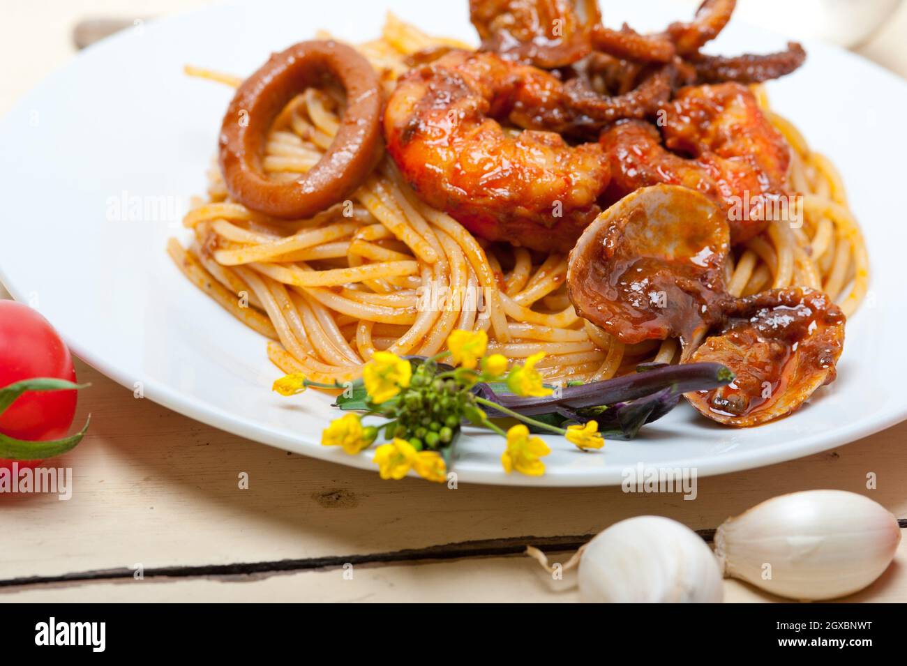 Italian Seafood Spaghetti Pasta On Red Tomato Sauce Over White Rustic ...