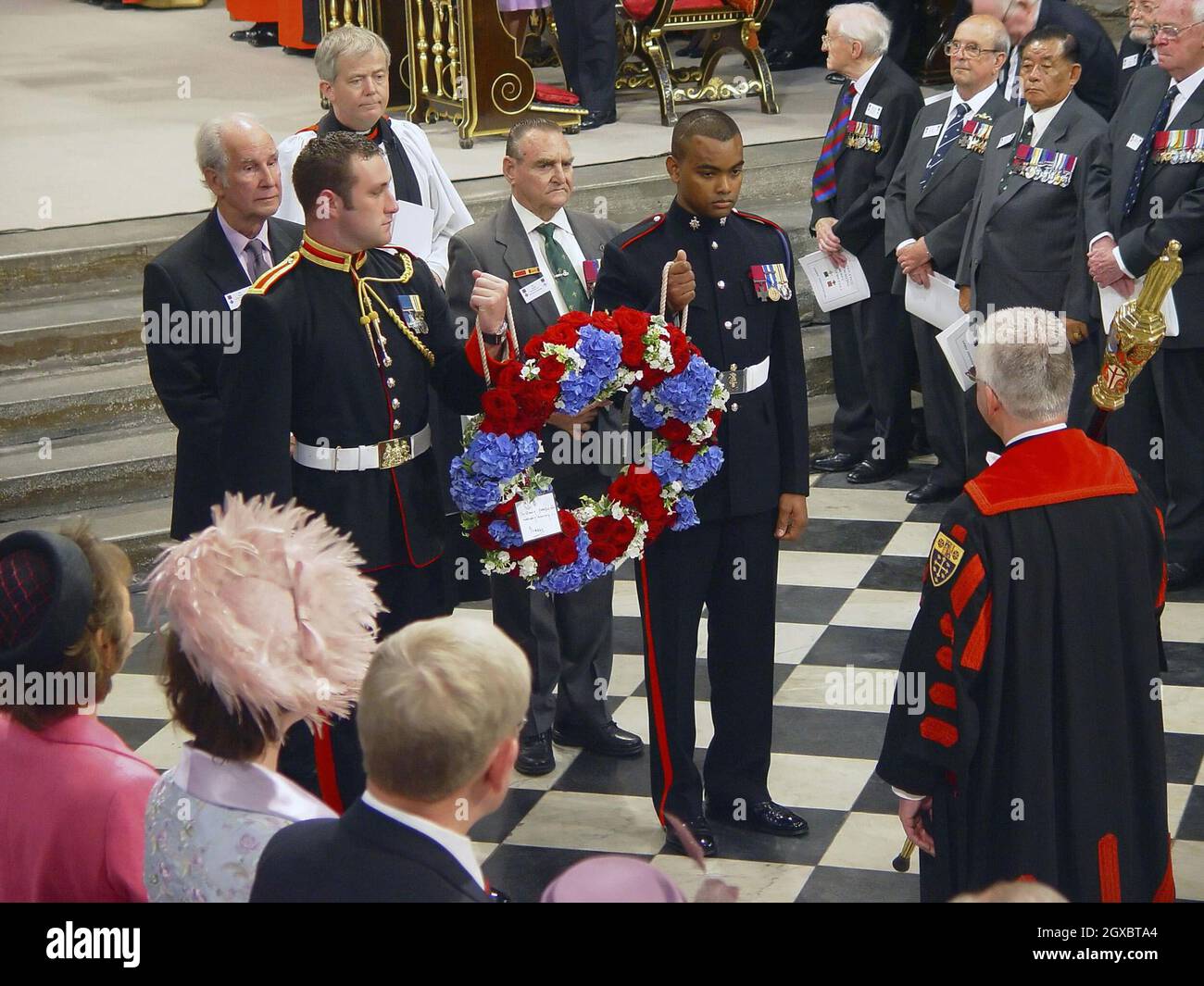 Private Johnson Beharry, who last year became the first new holder of the Victoria Cross in more than two decades, carries a wreath with other Victoria and George Cross holders. Stock Photo