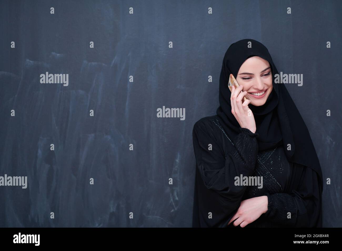 young modern muslim business woman using smartphone wearing hijab ...
