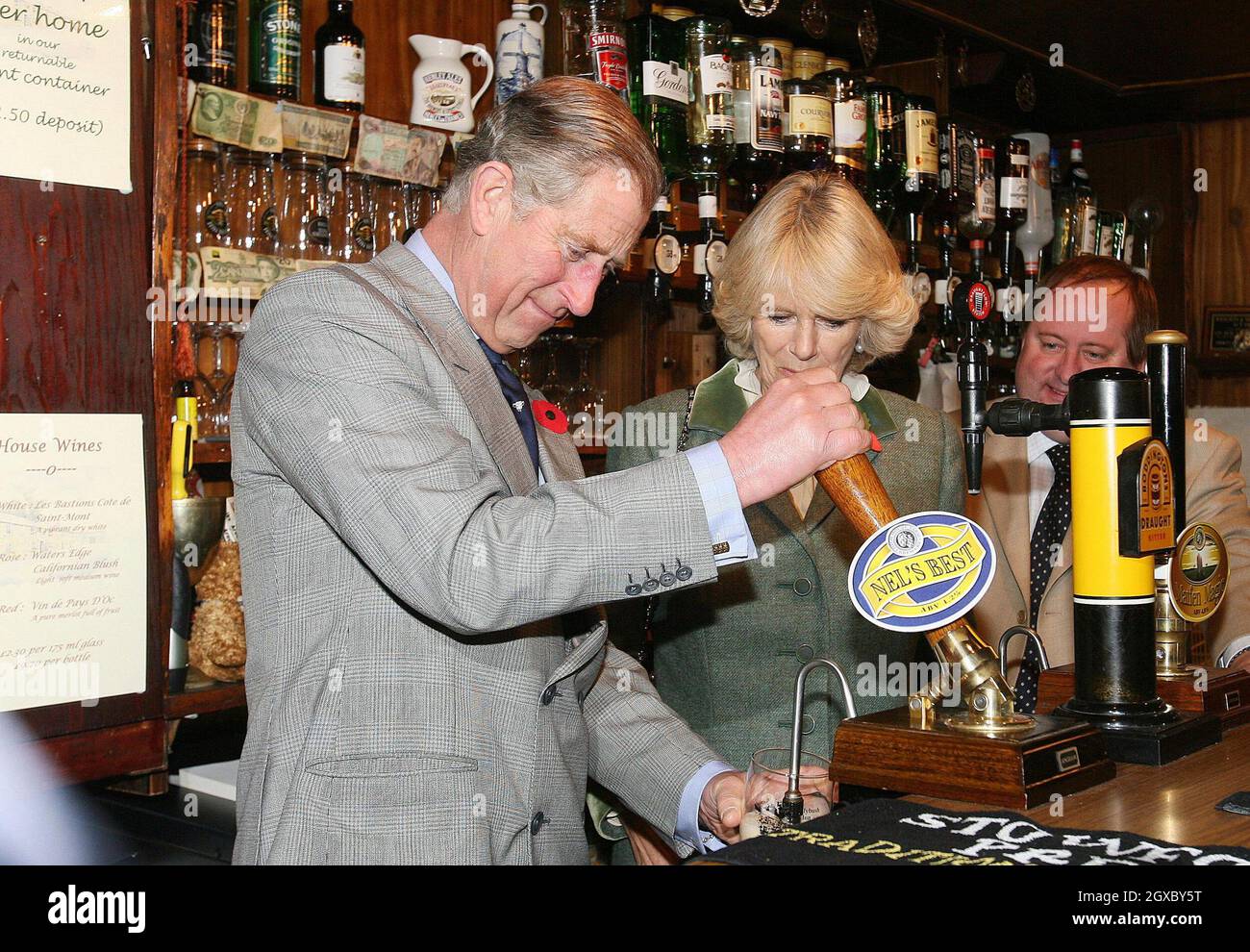 Camilla Rural Rave Prince Charles, Prince of Wales pulls a pint while Camilla looks on in ...