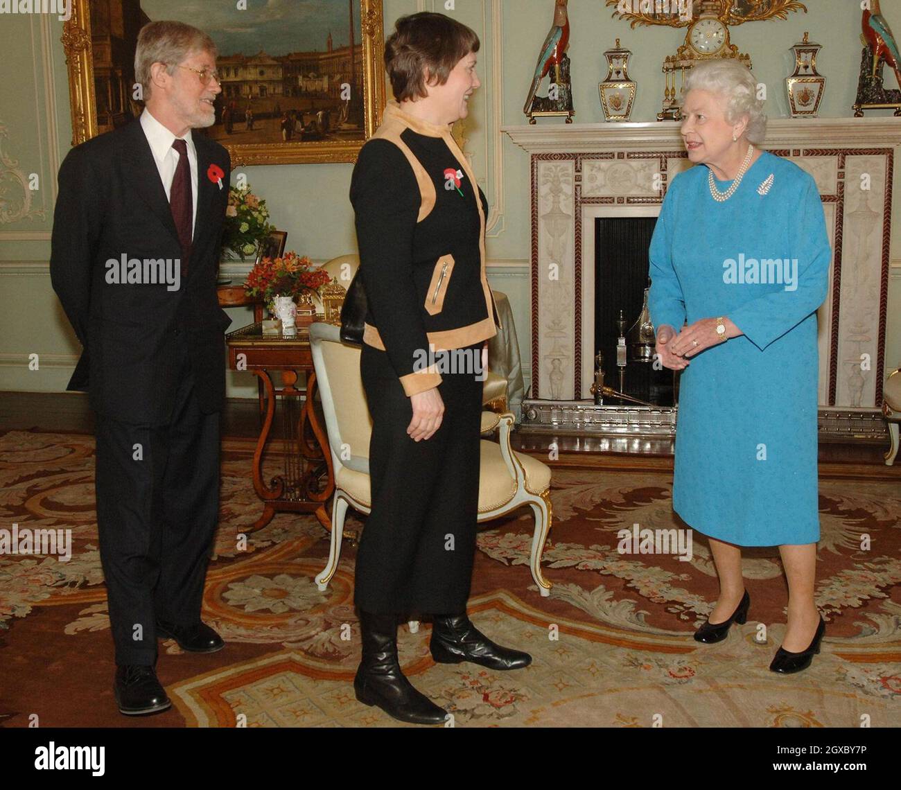 Queen Elizabeth II meets New Zealand's Prime Minister, Helen Clark and her husband Peter Davis at Buckingham Palace in London on November 10, 2006. Anwar Hussein/EMPICS Entertainment Stock Photo