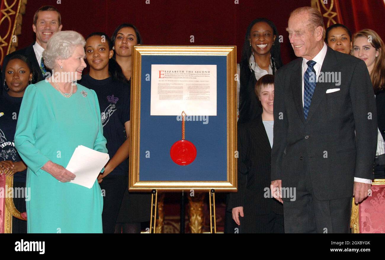 Prince Philip, Duke of Edinburgh accepts a Royal Charter from Queen Elizabeth II on behalf of his awards scheme during a reception at Buckingham Palace on November 16, 2006. The Duke of Edinburgh Award scheme celebrates its 50th anniversary after being founded by Philip, who was inspired by his days at Gordonstoun school in Scotland. The charity runs one of the best-known adventure programmes for able-bodied and disabled young people aged 14 to 25. Anwar Hussein/EMPICS Entertainment Stock Photo