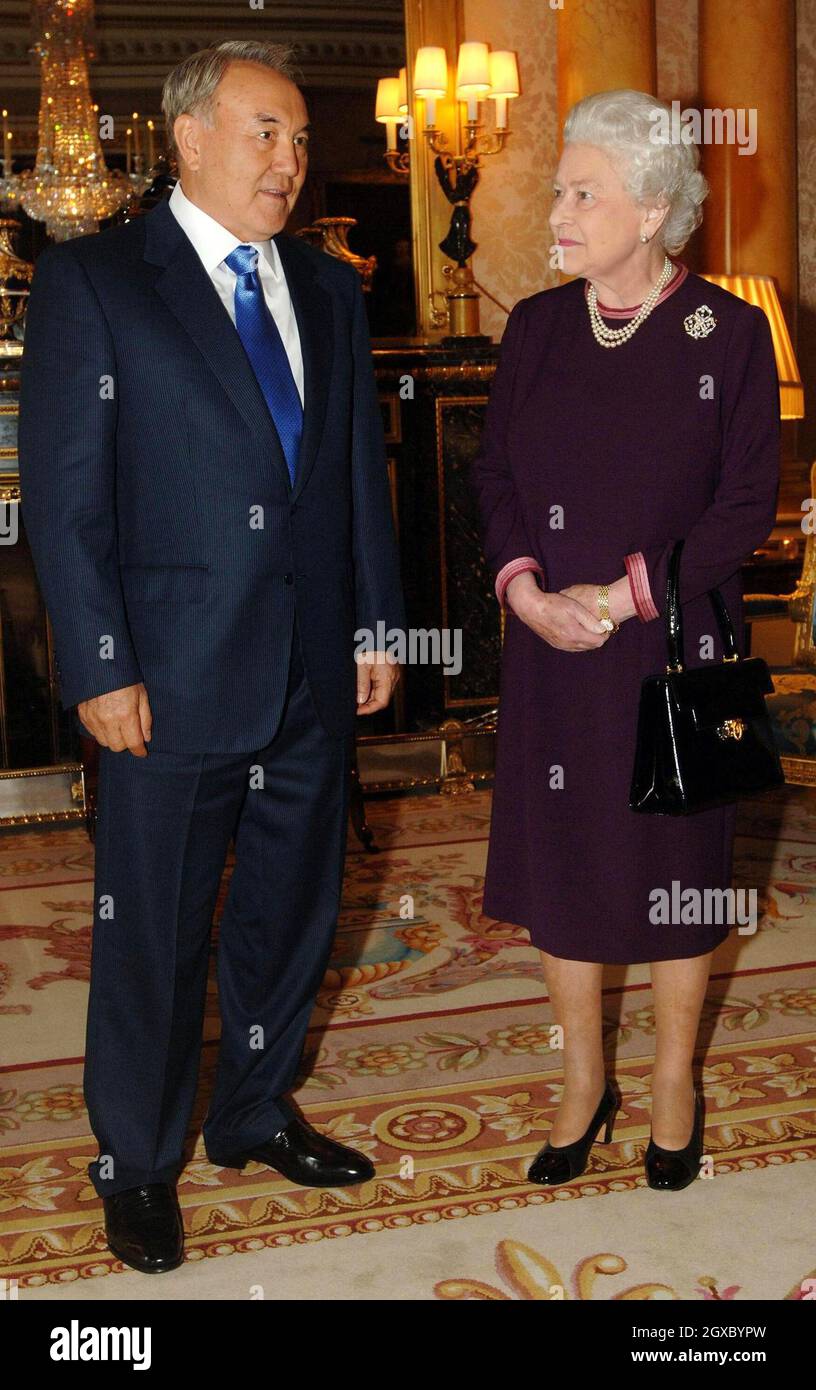 Queen Elizabeth II meets the President of the Republic of Kazakhstan, Mr Nursultan Nazarbayev, at Buckingham Palace in London on November 21, 2006. The President had laughed off insults to his country by the fictional TV reporter Borat - alter ego of comic Sacha Baron Cohen. Anwar Hussein/EMPICS Entertainment Stock Photo