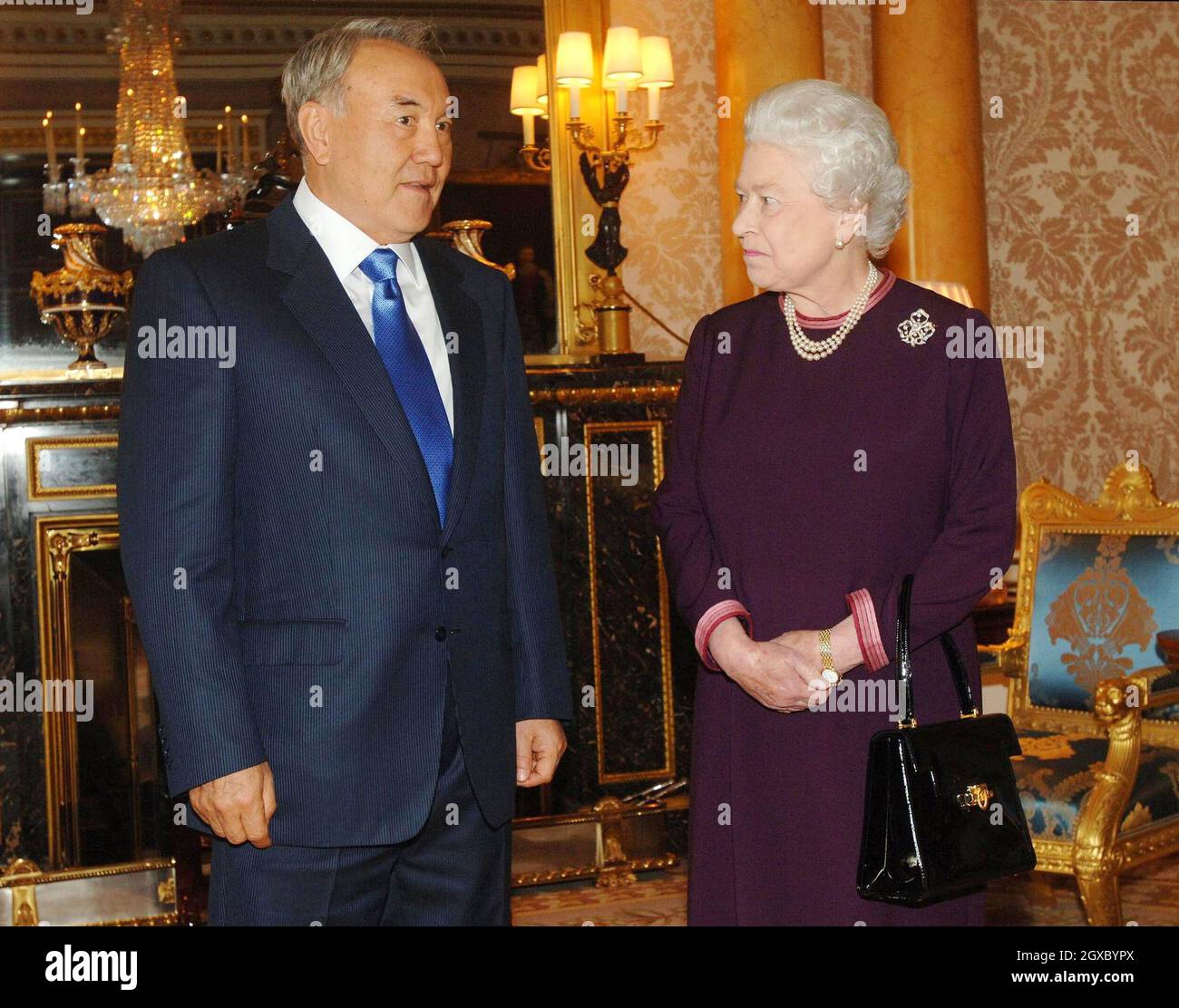 Queen Elizabeth II meets the President of the Republic of Kazakhstan, Mr Nursultan Nazarbayev, at Buckingham Palace in London on November 21, 2006. The President had laughed off insults to his country by the fictional TV reporter Borat - alter ego of comic Sacha Baron Cohen. Anwar Hussein/EMPICS Entertainment Stock Photo