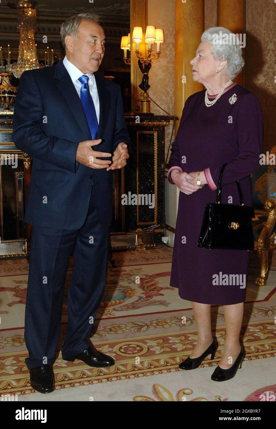 Queen Elizabeth II meets the President of the Republic of Kazakhstan, Mr Nursultan Nazarbayev, at Buckingham Palace in London on November 21, 2006. The President had laughed off insults to his country by the fictional TV reporter Borat - alter ego of comic Sacha Baron Cohen. Anwar Hussein/EMPICS Entertainment Stock Photo