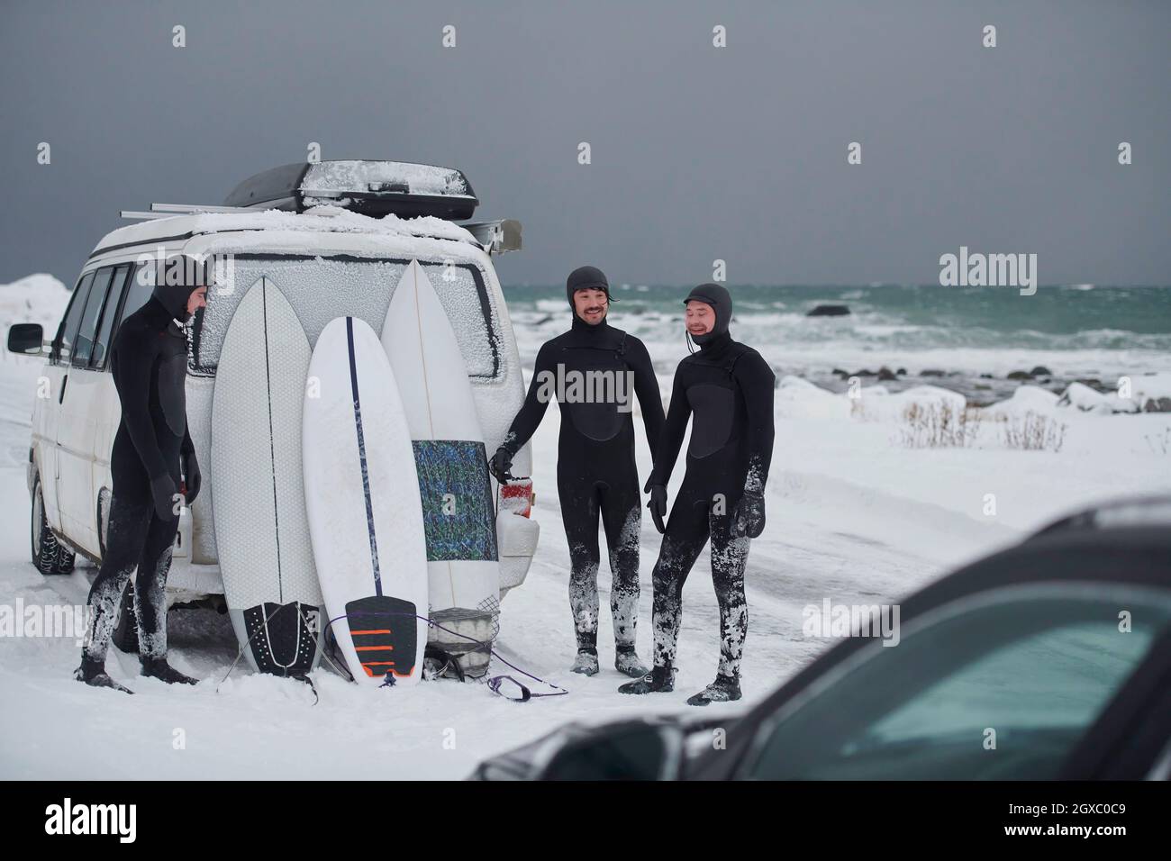 Authentic local Arctic surfers in wetsuit after surfing in Norwegian