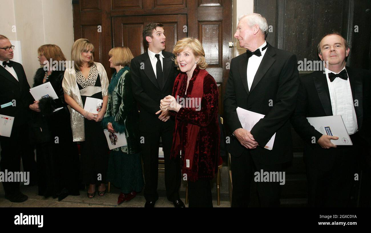 Presenters of the 'The Story of Christmas' (left-right) Harry Enfield, Samantha Bond, Kim Medcalf, Joanna David, Dan Stevens, Patricia Hodge, Bob Wilson and Ian Hislop, stand in line after the presentation at St.George's Church on December 19, 2006 in London, England. Stock Photo