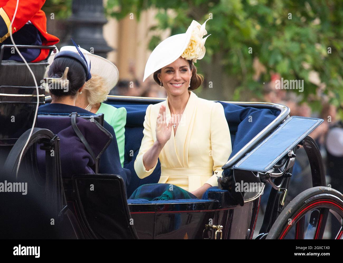 Catherine, Duchess of Cambridge rides in an open carriage during ...