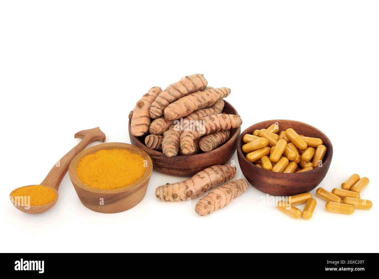 Turmeric root spice with powder and dietary supplement capsules. Food