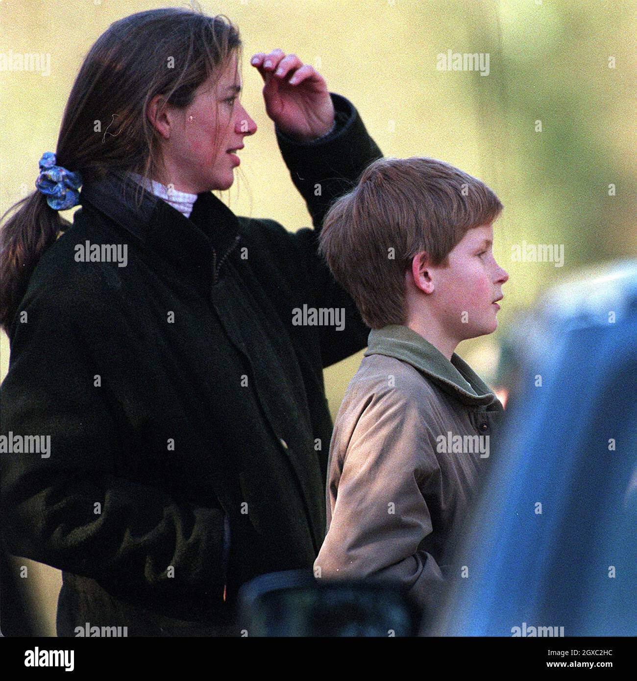 Prince Harry and his nanny Tiggy Legge-Bourke watch the Prince of Wales take part in the Beaufort Hunt in March 1997 Stock Photo
