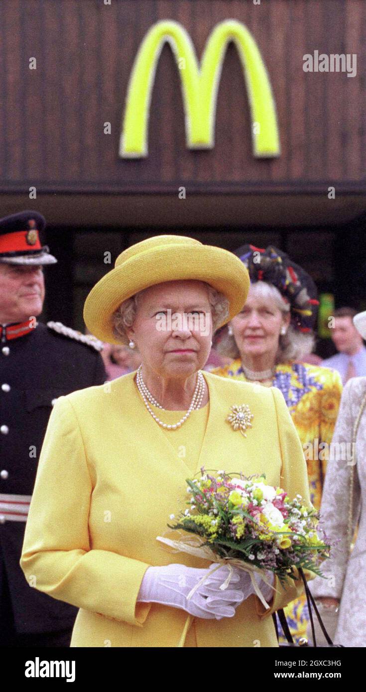 Queen Elizabeth II arrives at McDonalds drive-thru restaurant on a visit to ChesHire Oaks Designer Outlet, Ellesmore Port on 31 July, 1998. Prince Charles, Prince of Wales has caused controversy during his visit to Abu Dhabi on 27 Feb 2007 saying that McDonalds should be banned on health grounds.  Stock Photo