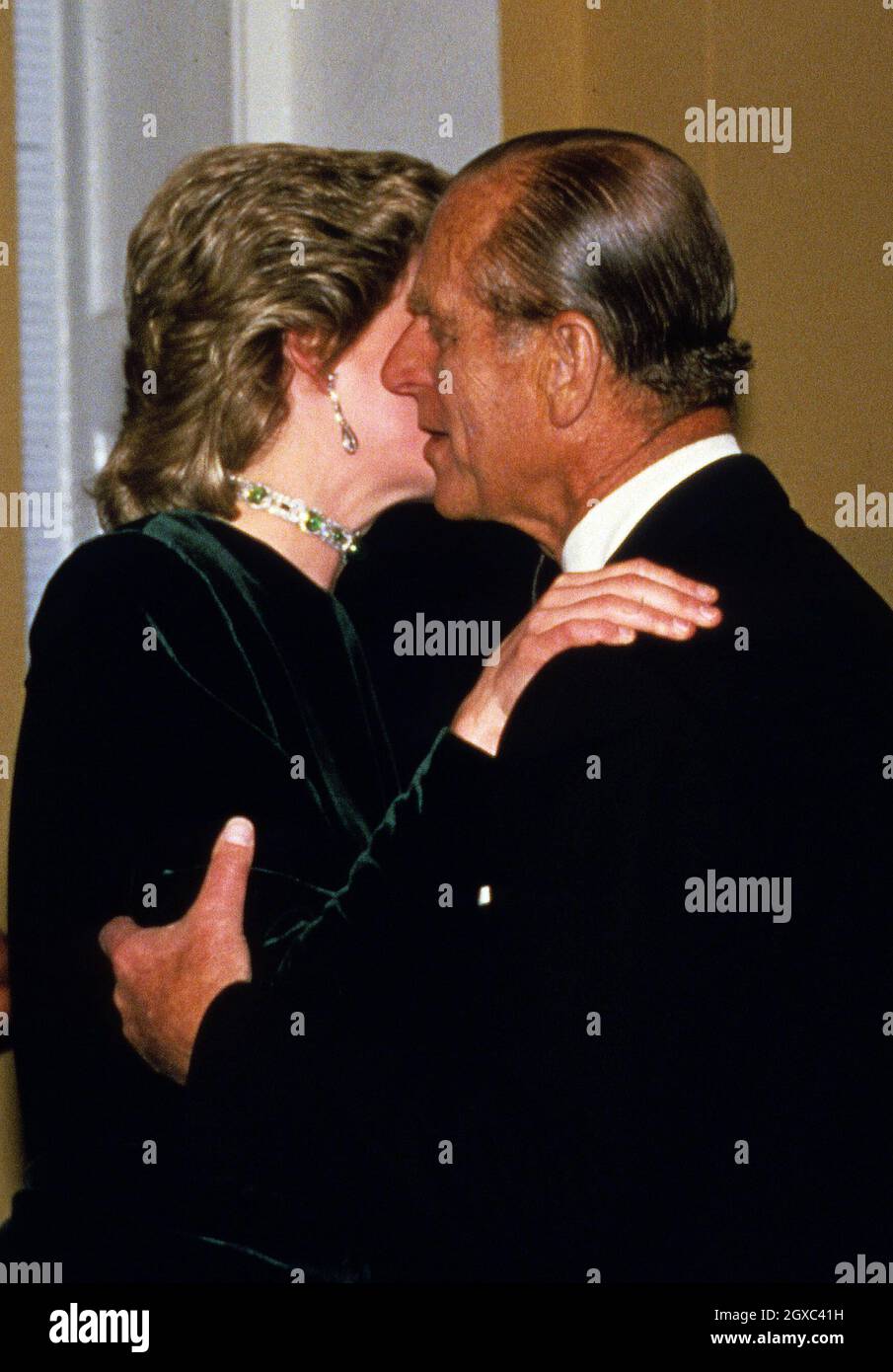 Prince Philip, Duke of Edinburgh receives a kiss from Diana, Princess of  Wales in London Stock Photo - Alamy