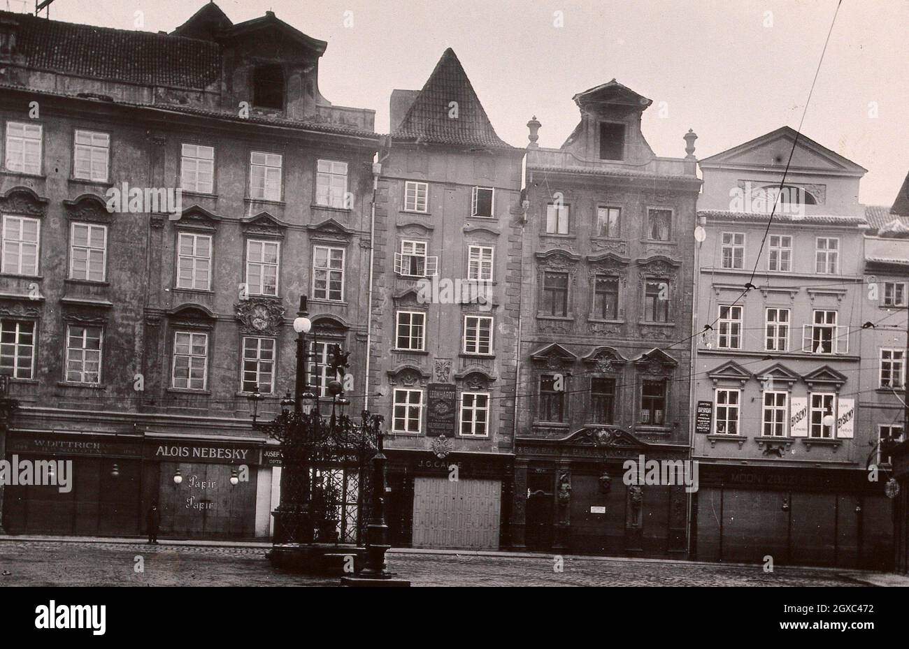 The front of a pharmacy in a cobbled square in Prague. Photograph. - Contributors Reach, Zikmund. Lettering. Kleinen Ring Prag I. Für ''Golden Stock Photo