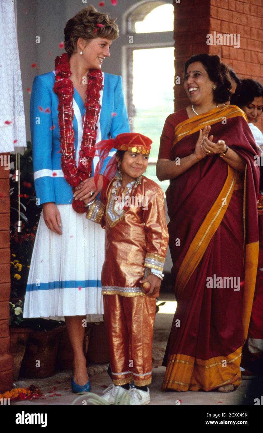 Diana, Princess of Wales holds hands with a child at the Tamana Special Needs Nursery School in Delhi, India on February 12, 1992. Stock Photo