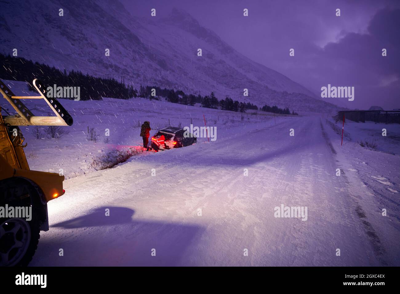 Car being towed after accident in snow storm in Scandinavian icy road ...