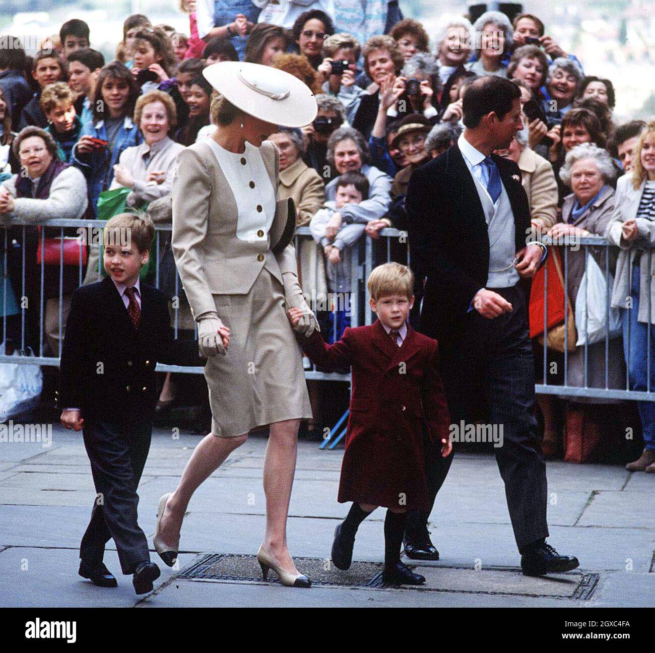 Prince William, Diana, Princess of Wales, Prince Harry and Prince Charles, Prince of Wales, attend the wedding of the Duke of Hussey's daughter in May, 1989 in Bath, England. Stock Photo