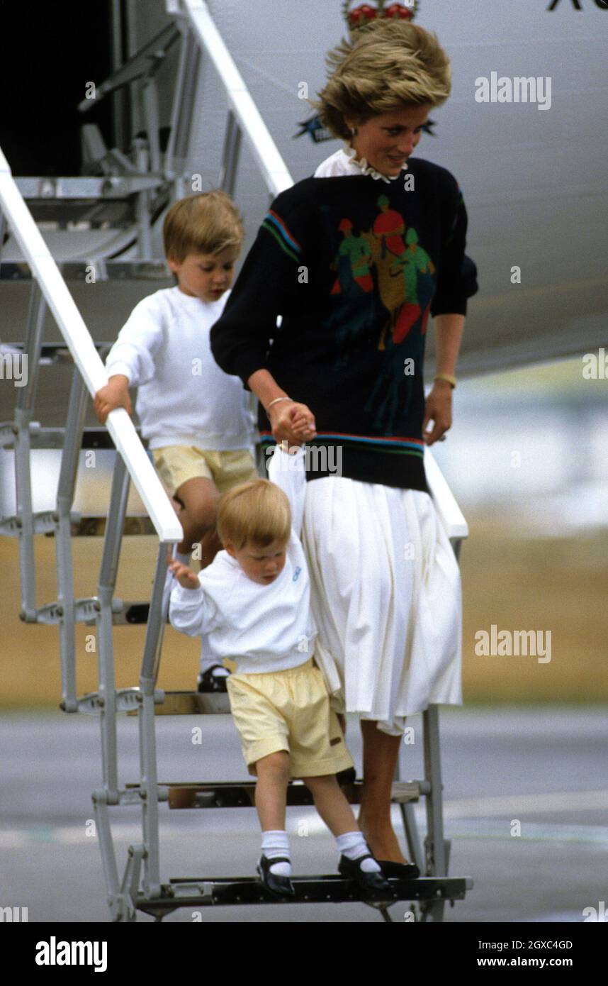Diana, Princess of Wales, with her young sons Prince William and Prince Harry arrive at Aberdeen Airport for the start of their holidays in Scotland on August 18, 1986. Stock Photo