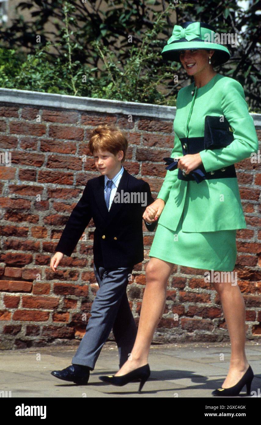 Diana, Princess of Wales and Prince Harry walk to St. George's Chapel to attend the wedding of Lady Helen Windsor to Tim Taylor on July 18, 1992 in Windsor, England. Stock Photo