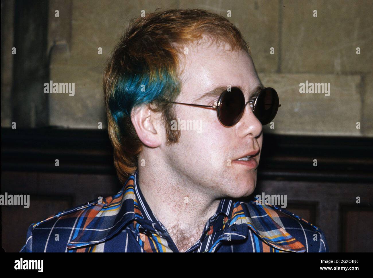 Elton John at a party in London, circa 1975. Stock Photo