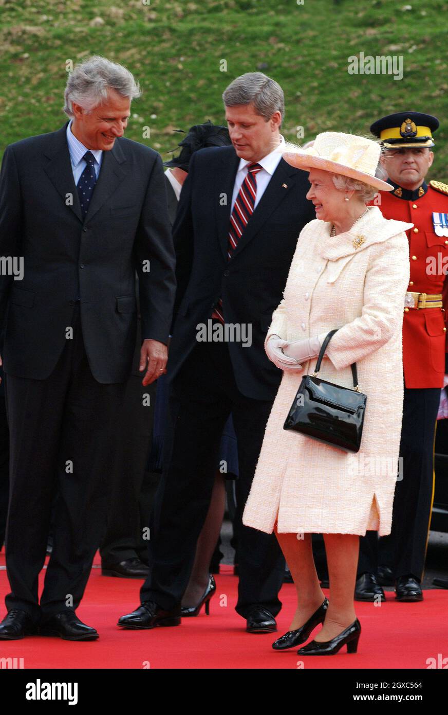 Queen Elizabeth II, French Prime Minister Dominique de Villepin (left) and  Canadian Prime Minister Stephen Harper (centre) attend a ceremony to mark  the 90th anniversary of the Battle of Vimy Ridge, in