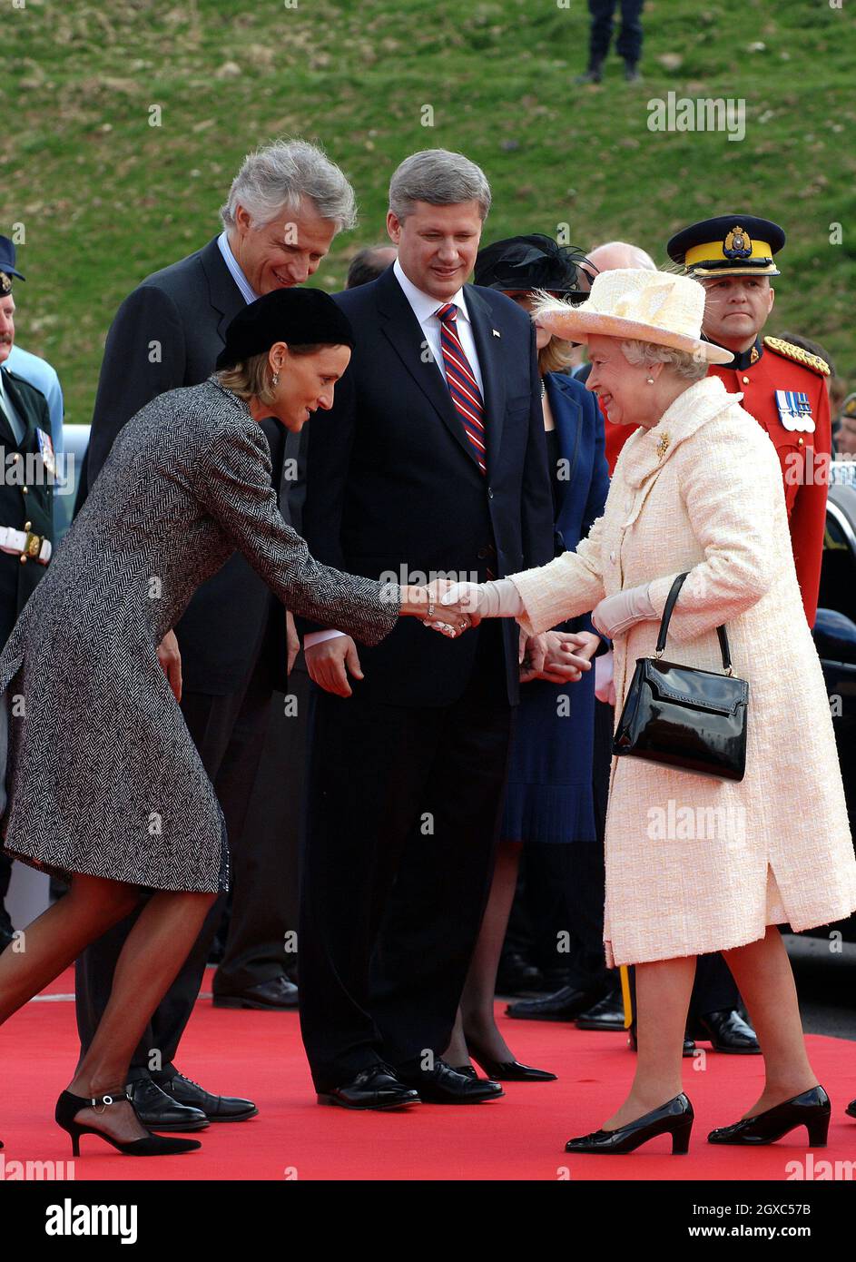 Queen Elizabeth II greets Marie-Laure, wife of French Prime Minister  Dominique de Villepin, during a ceremony to mark the 90th anniversary of  the Battle of Vimy Ridge, in which more than 3,500