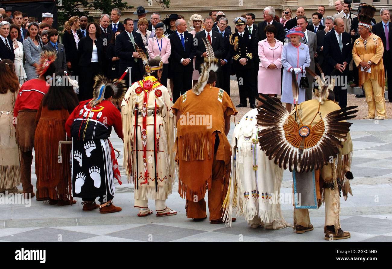 Queen Elizabeth II and Prince Philip, Duke of Edinburgh watch a Native ...
