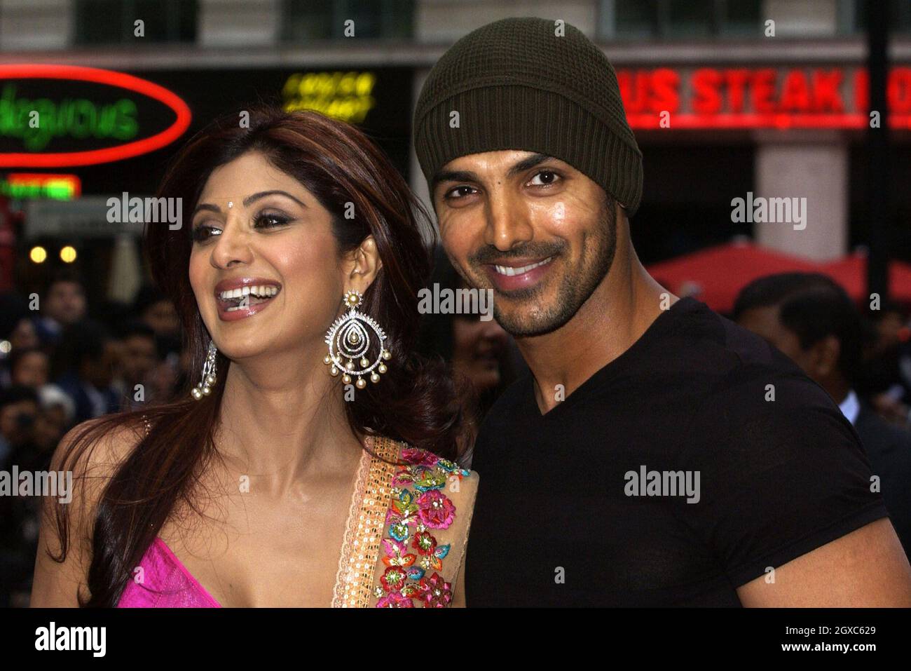 Indian actress Shilpa Shetty poses with Bollywood actor John Abraham while arriving for the World Premiere of Life In A Metro at the Empire Cinema in Leicester Square, central London on May 8, 2007. Stock Photo