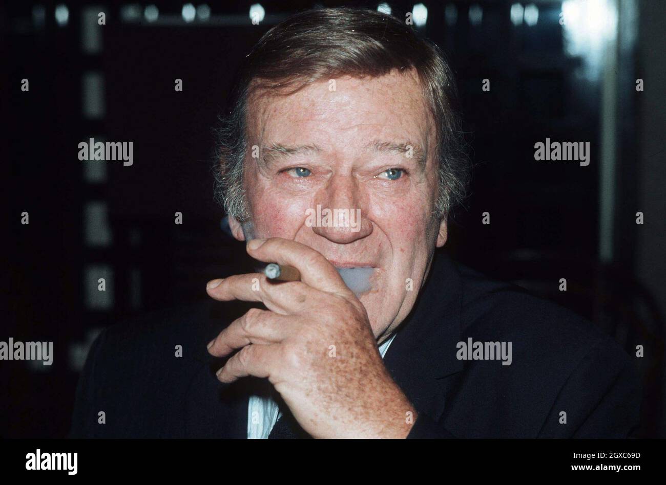 John Wayne, one of the greatest male film stars of all time, would have been 100 on May 26, 2007. He was diagnosed with lung cancer in 1964 and put this down to his heavy smoking habit. Stock Photo