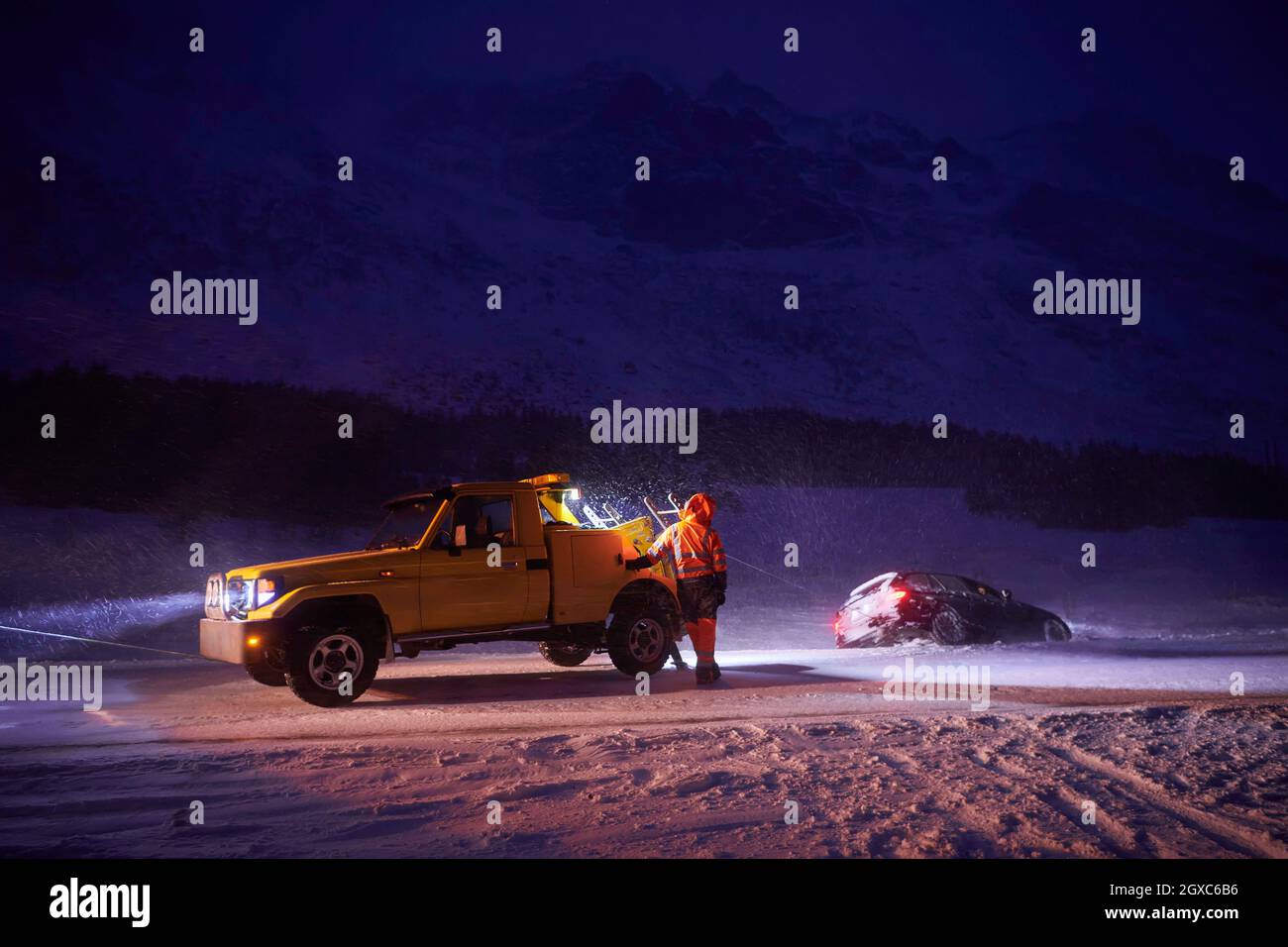 Car being towed after accident in snow storm in Scandinavian icy road ...