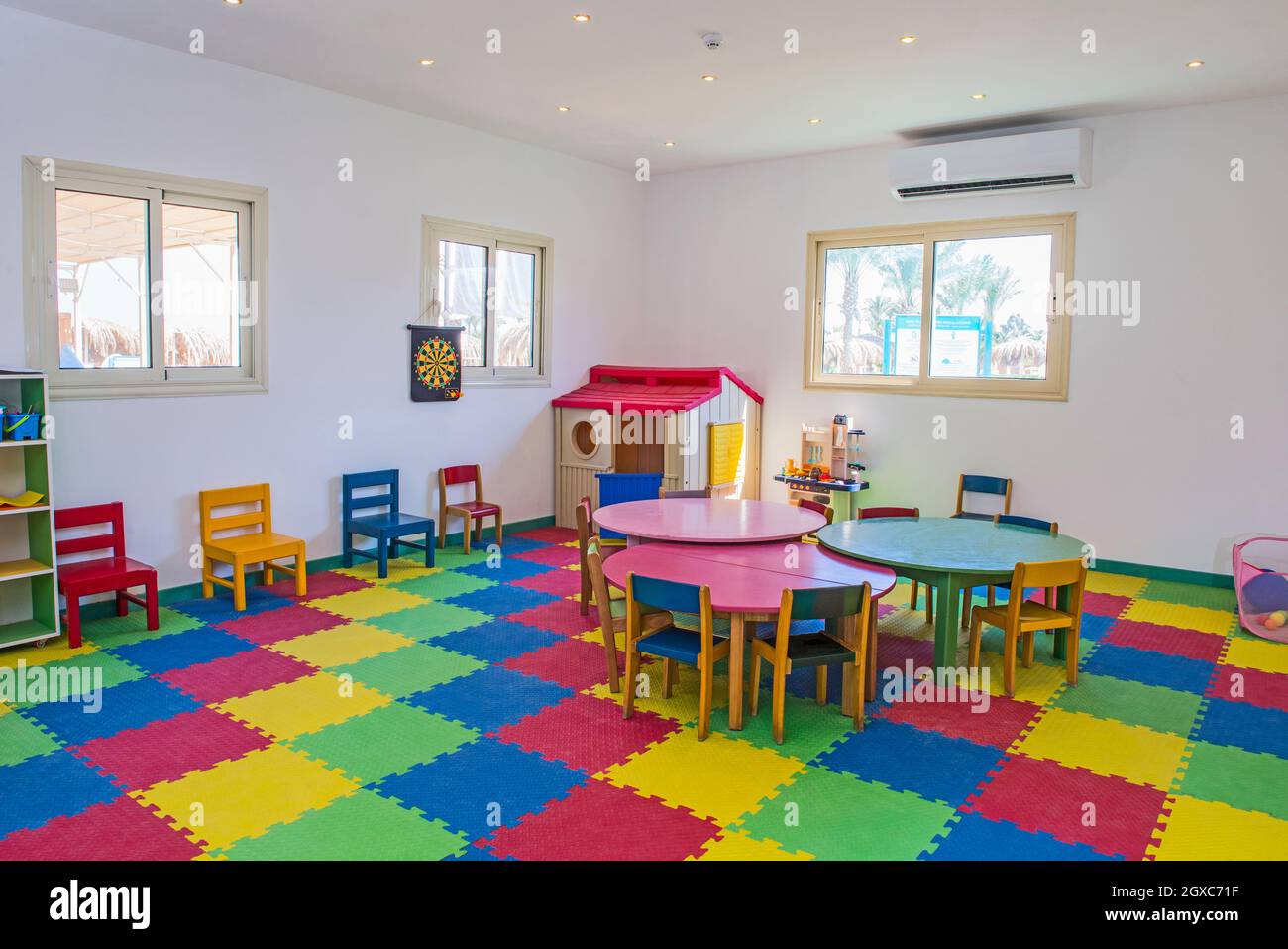 Interior design of large colorful childrens play room area kids club in hotel with games and toys Stock Photo