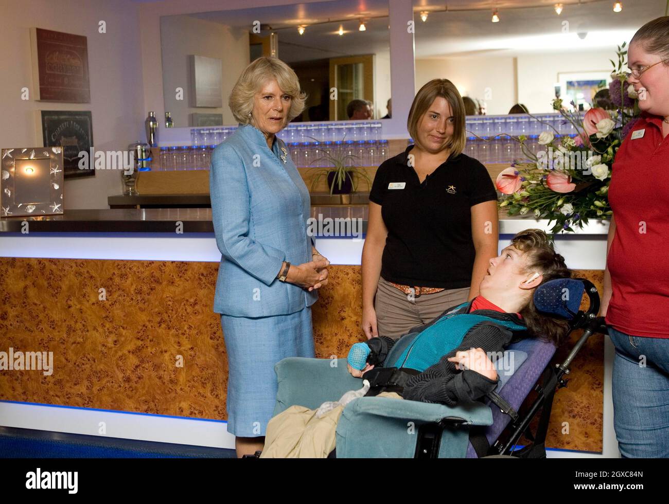 Camilla, Duchess of Cornwall meets guest Katie Gerrard (in wheelchair) in the bar of Helen and Douglas House, a hospice and respite care centre for children and young adults, in Oxford. Stock Photo