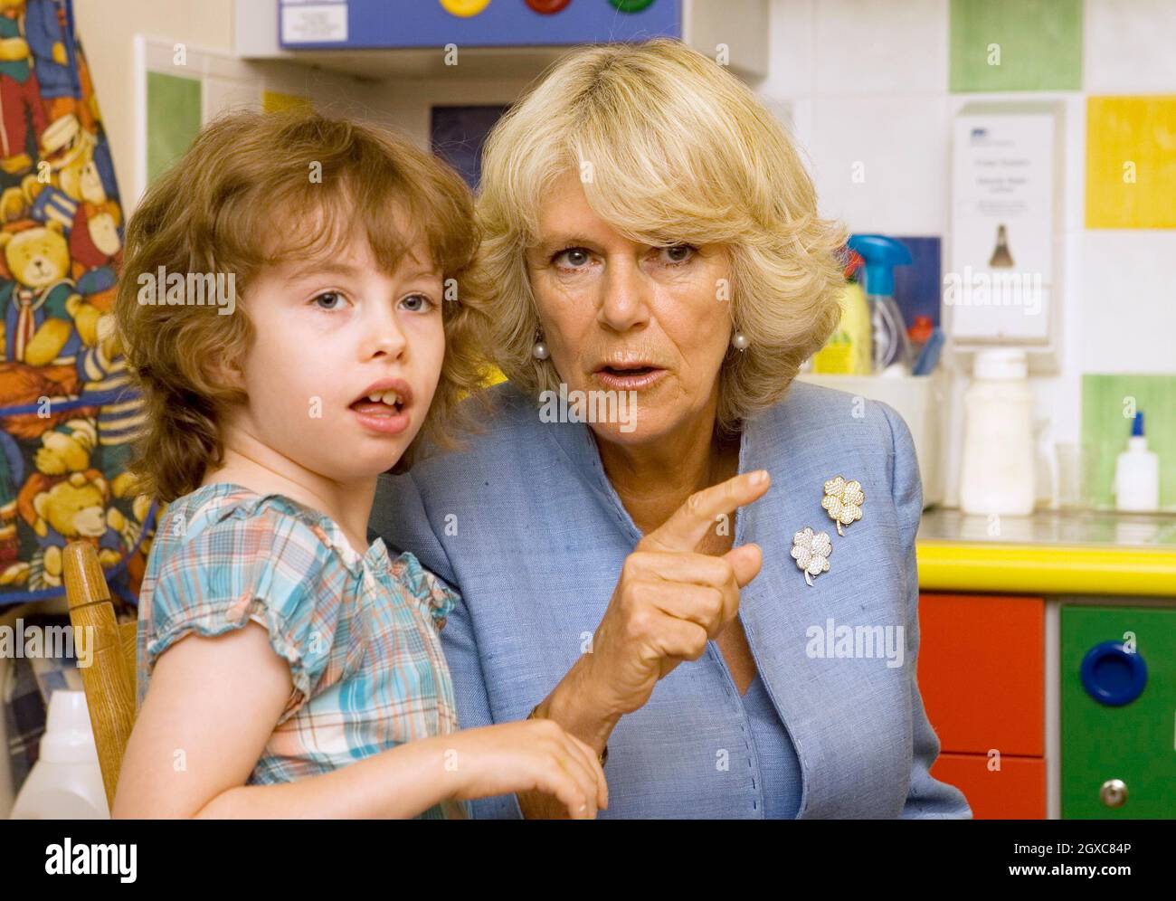 Camilla, Duchess of Cornwall chats to 8 year old Aislin Briggs in the arts and crafts room as she visits Helen and Douglas House, a hospice and respite care centre for children and young adults, in Oxford. Stock Photo