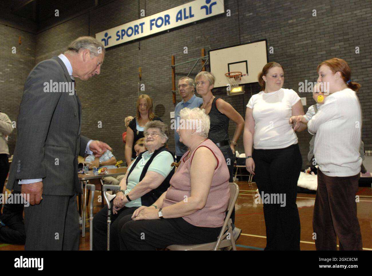 Prince Charles, Prince of Wales visits flood victims in the sports