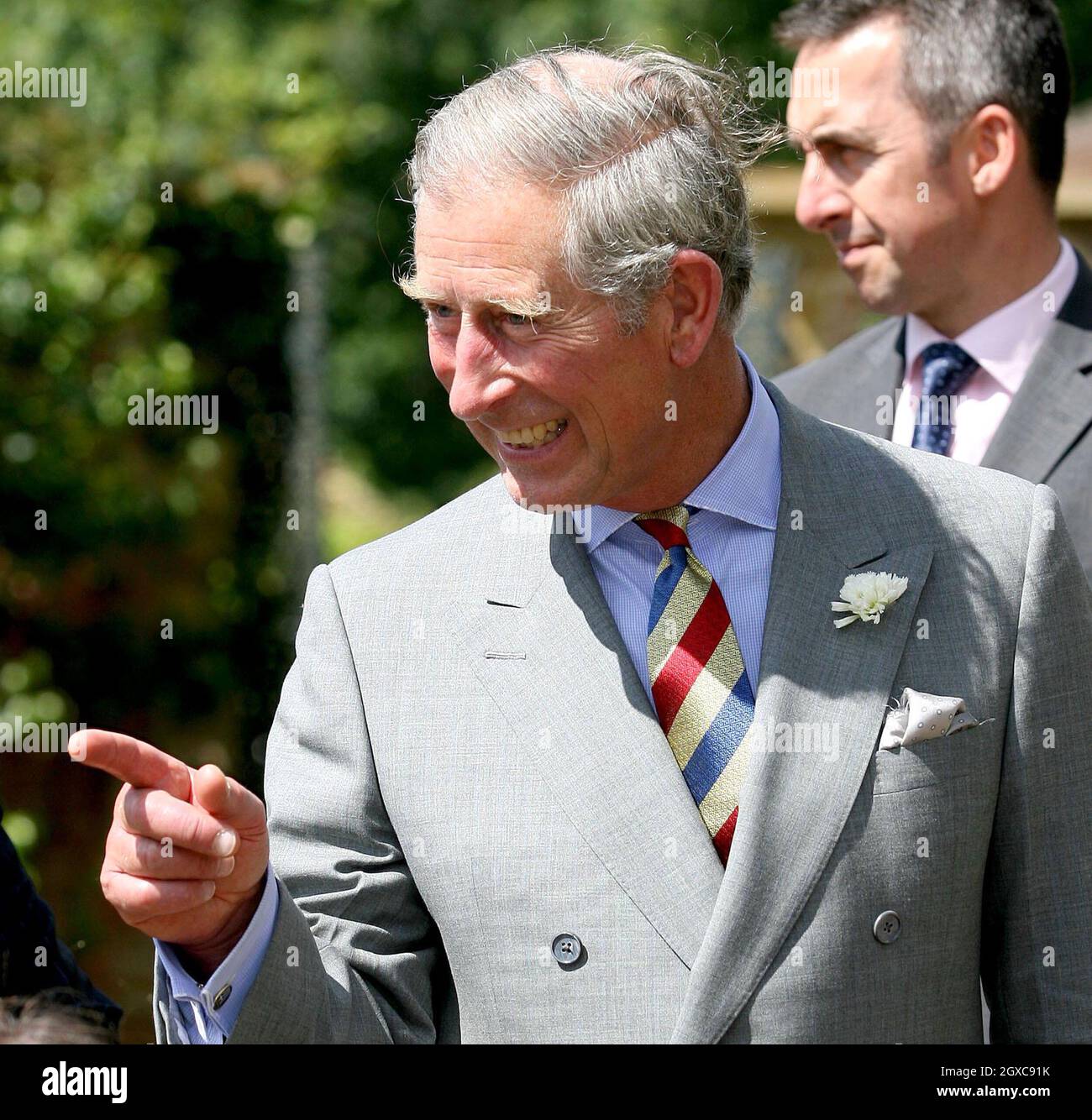 Prince Charles, Prince of Wales shares a joke with volunteers at Barrington Court in Barrington. Stock Photo