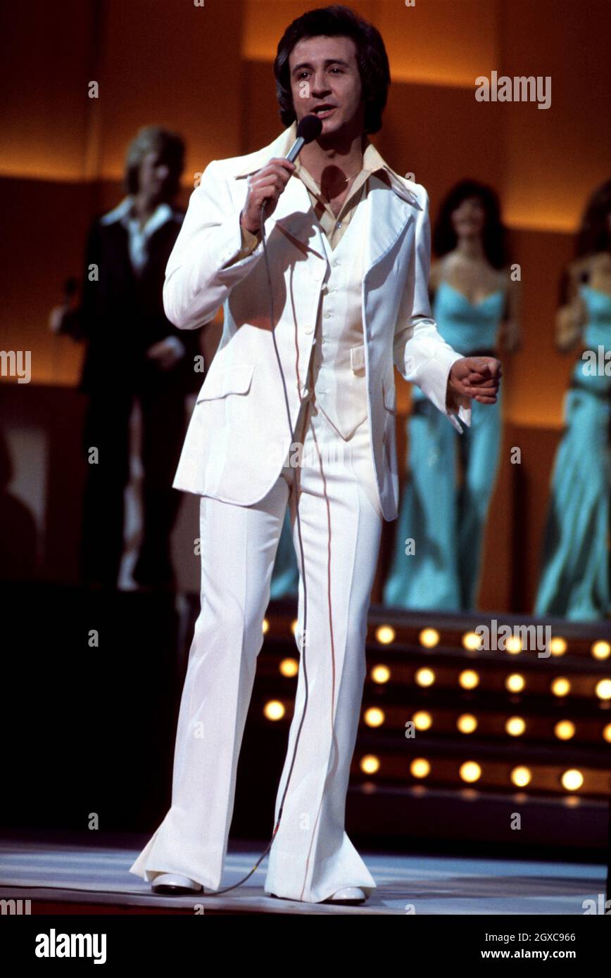 Singer Tony Christie performs on stage, circa 1975 Stock Photo
