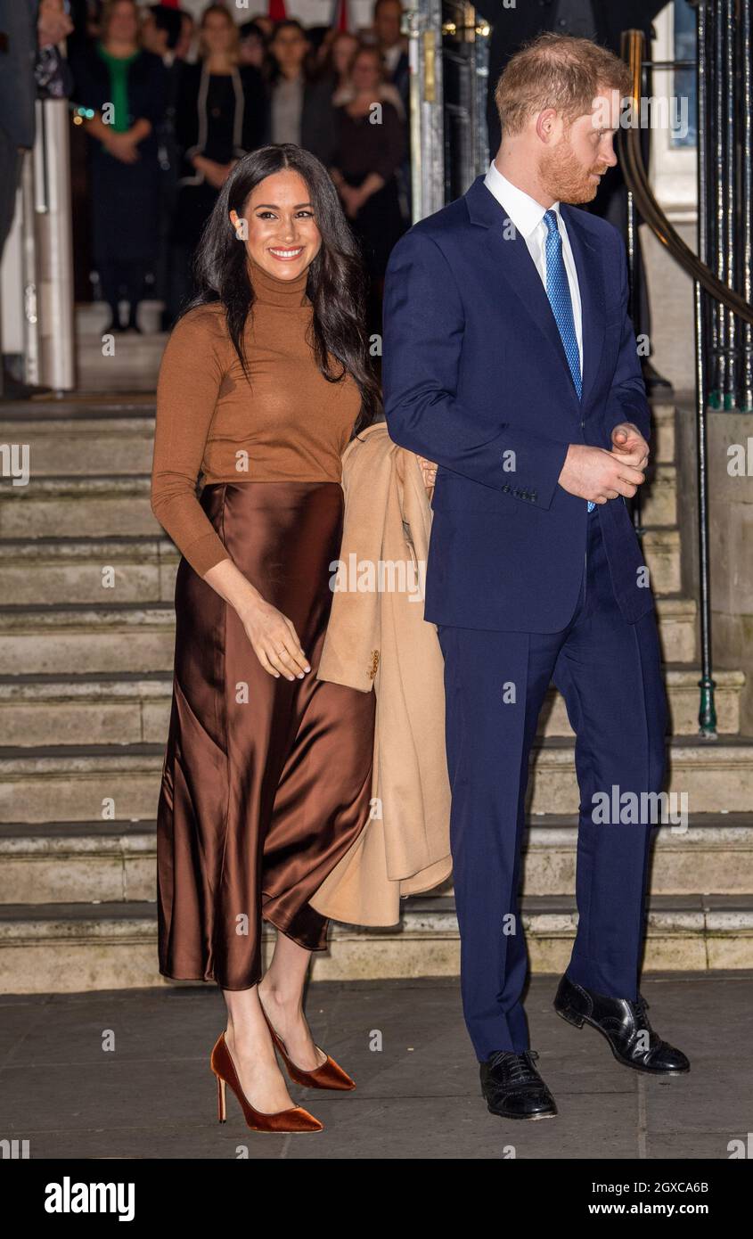 The Duchess of Sussex wearing a brown polo neck top and a Massimo Dutti  skirt, and The Duke of Sussex visit Canada House in London on January 07,  2020 Stock Photo - Alamy