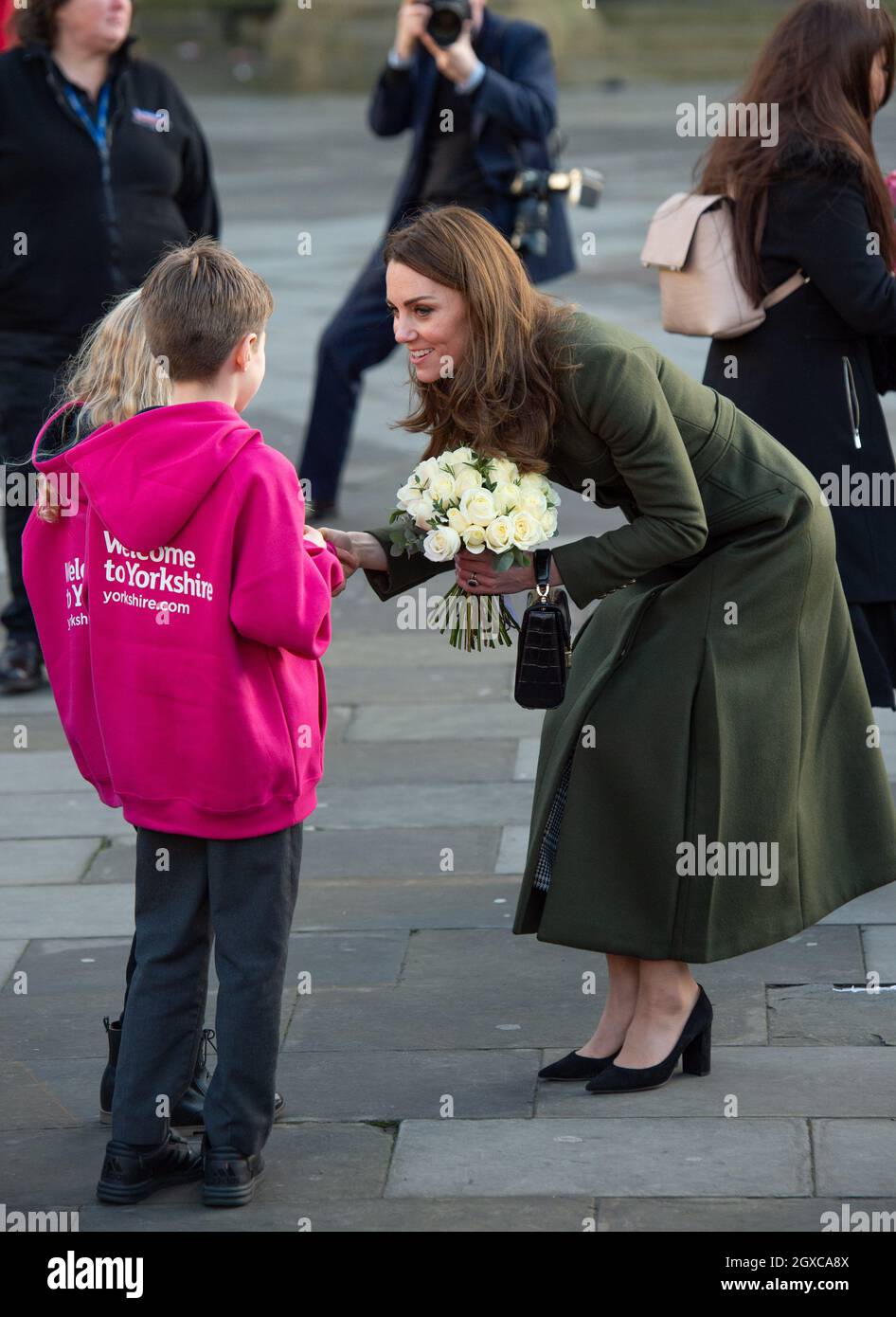 The Duchess of Cambridge wearing khaki coat by Alexander McQueen, receives white roses during a visit to Bradford, Yorkshire on January 15, 2020. Stock Photo