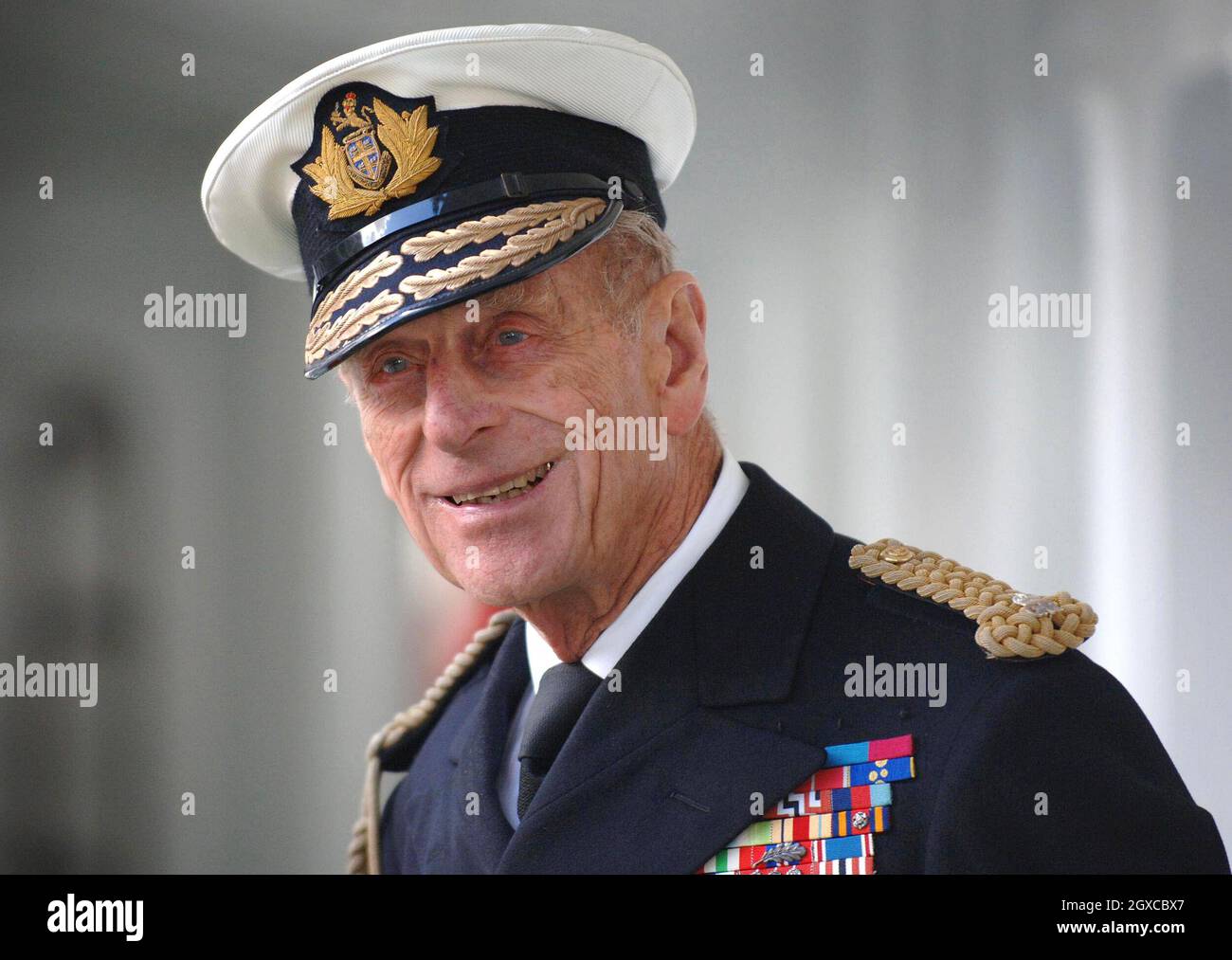 Prince Philip, Duke of Edinburgh, in his role as Master of Trinity House, waits to welcome Queen Elizabeth II aboard the new Trinity House Vessel 'THV Galatea',a Lighthouse Tender, which is moored on the Thames in London. Stock Photo