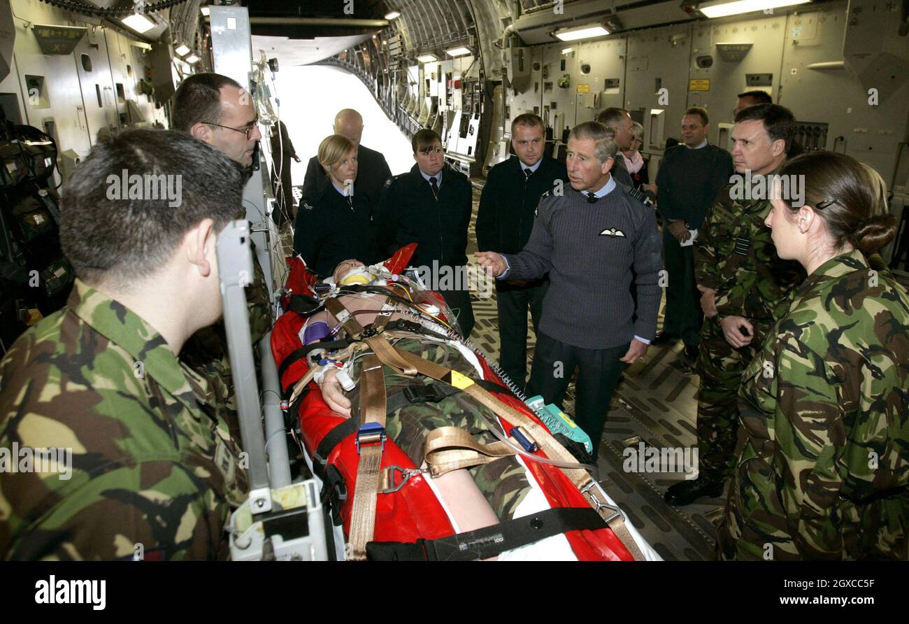 Prince Charles, Prince of Wales watches a demonstration by nurses and medics inside a C17 aircraft during a visit to RAF Brize Norton. The Prince returned to the Royal Air Force's Parachute Training School at the Brize Norton base in Oxfordshire for the first time since 1978. Stock Photo