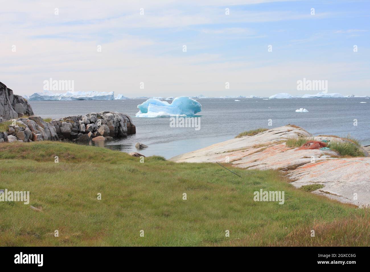 Greenland Coastal Rocks Coastal scenery with icebergs, Greenland Stock Photo - Alamy