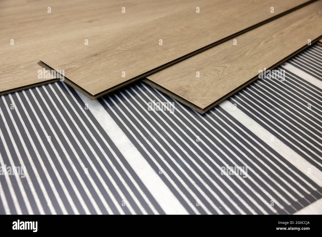 infrared underfloor heating film under laminate floor Stock Photo - Alamy