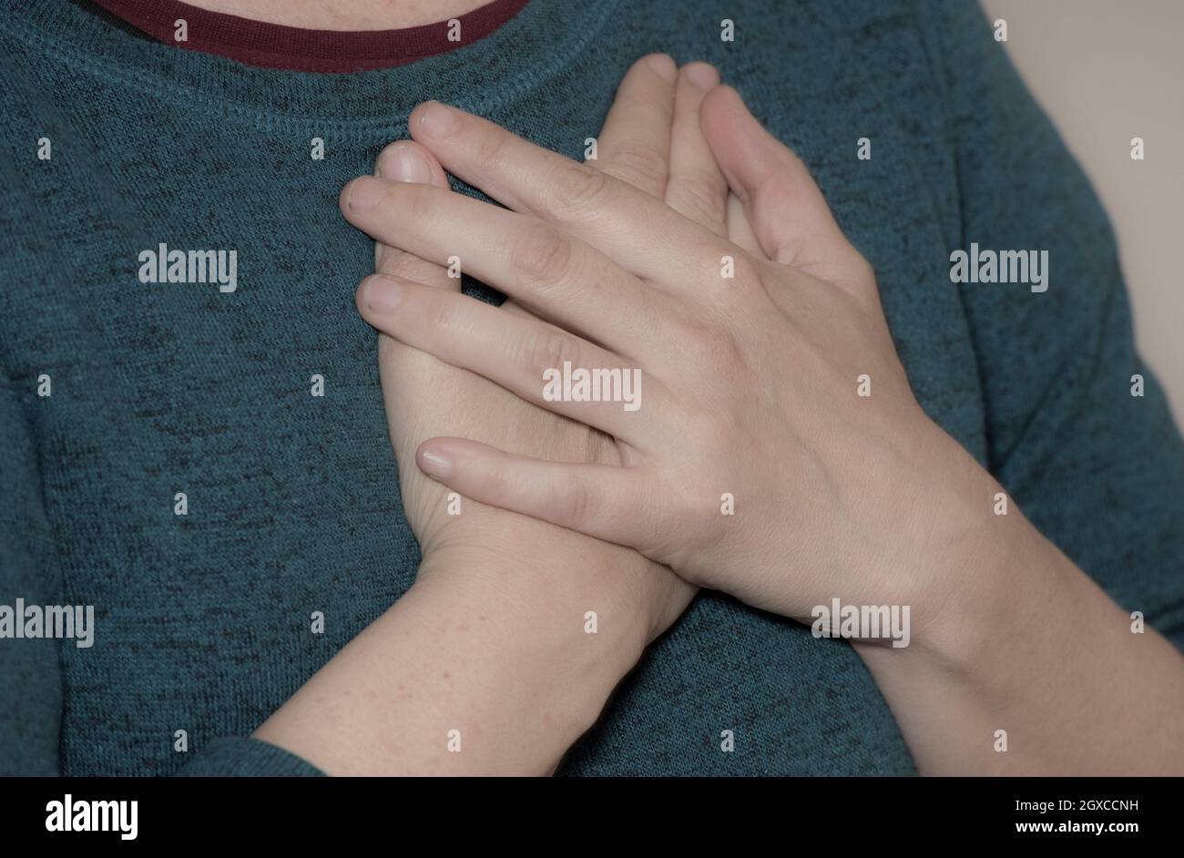 person having a heart attack, stabbing pain in the chest Stock Photo