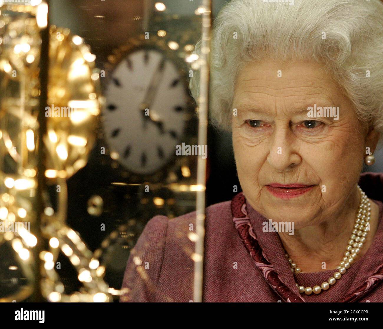Queen First Using Clock Queen Elizabeth ll looks at a gift of a replica of the St. Pancras ...