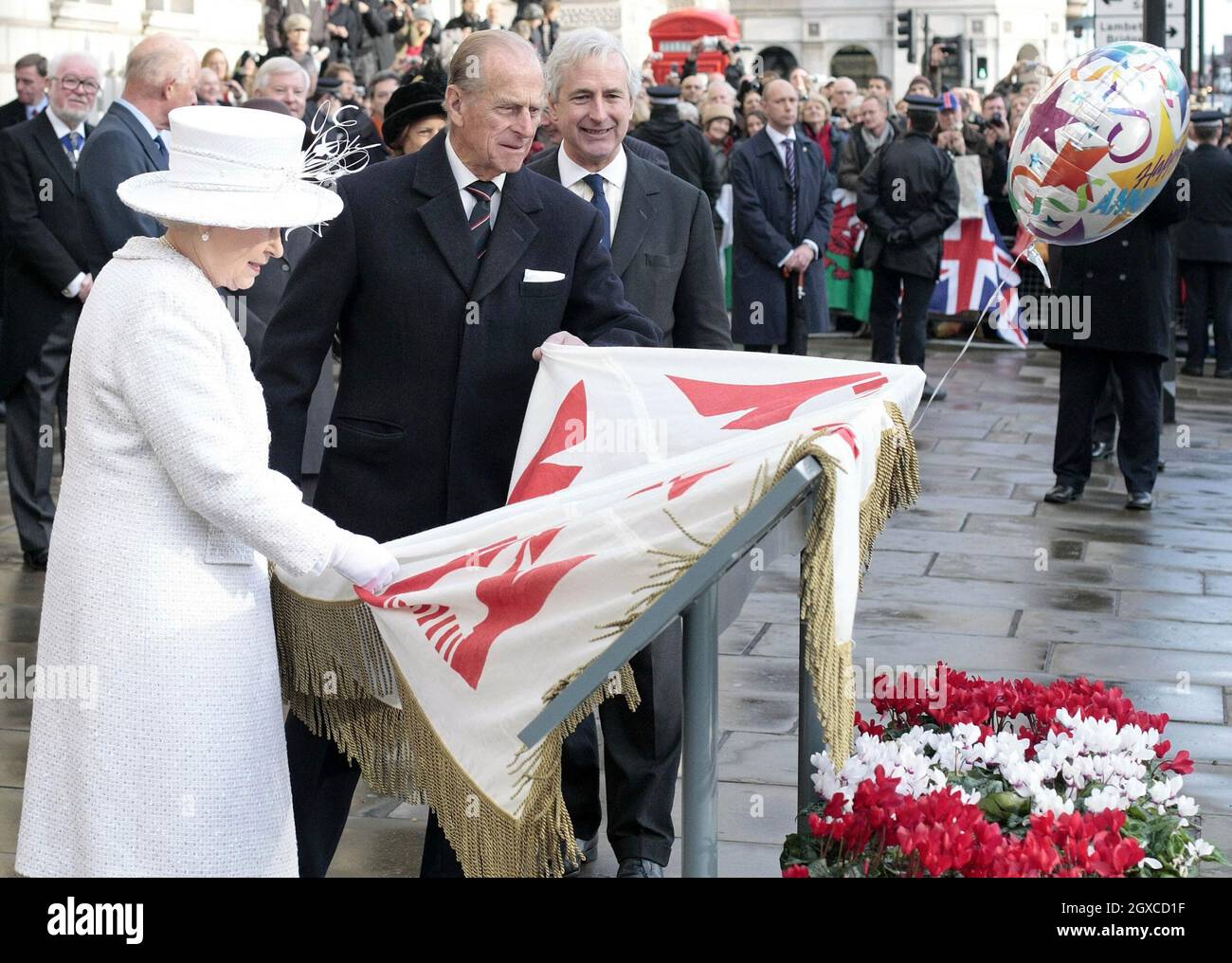 Queen Elizabeth ll and Prince Philip, Duke of Edinburgh unveil the Jubilee Walkway panel on Parliament Square following a service of celebration for their diamond wedding anniversary at Westminster Abbey in London. Stock Photo