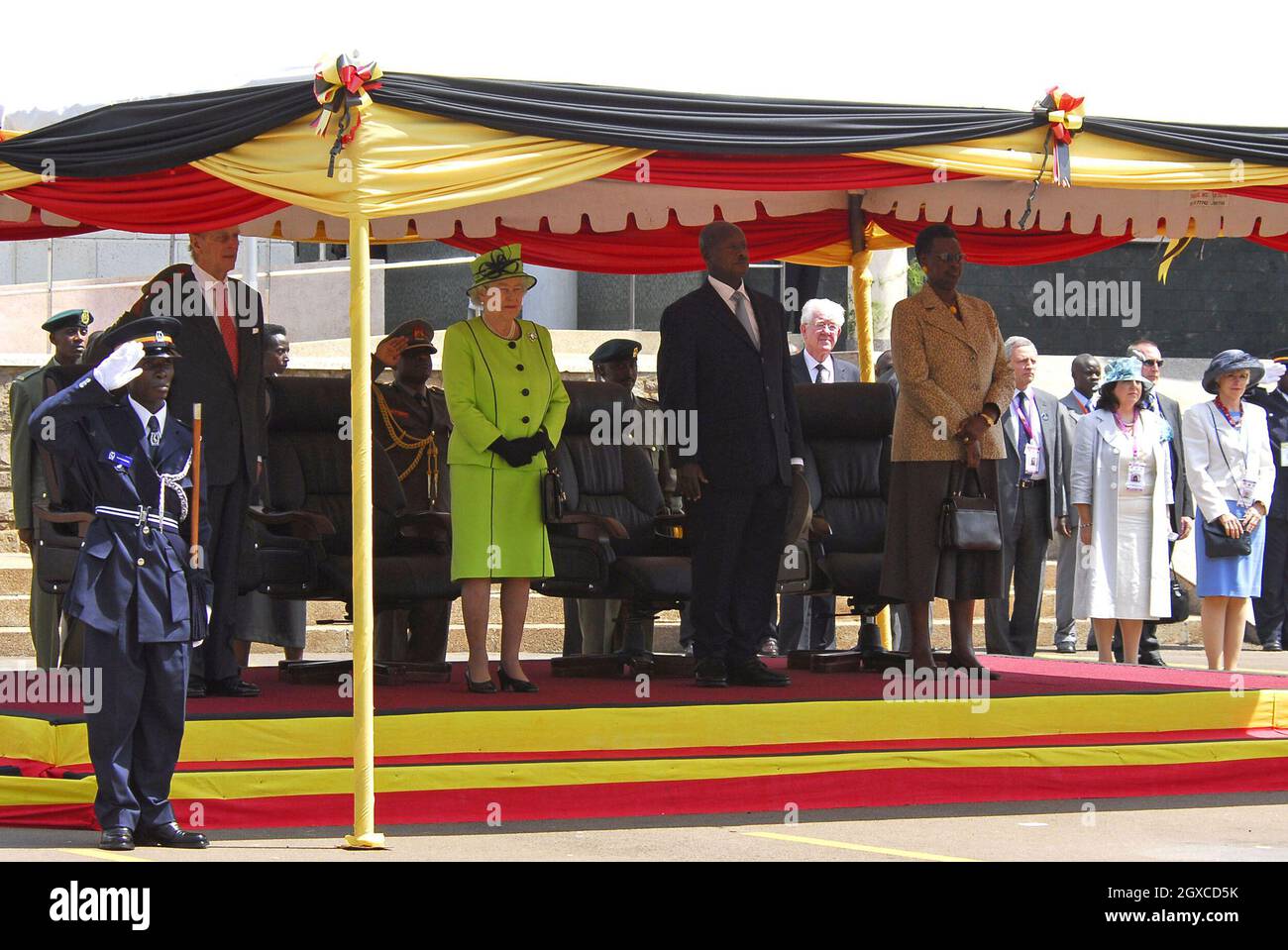 Queen Elizabeth ll and Prince Philip, Duke of Edinburgh stand with President Yoweri Museveni and wife Janet during a visit to the Ugandan Parliament in Kampala, Uganda. Stock Photo