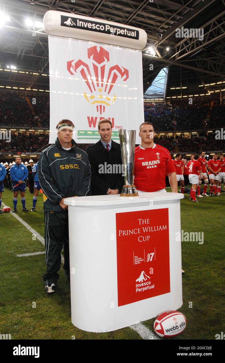 Prince William stands with the Prince William Cup and South Africa's rugby team captain John Smit (left) and Wales' rugby team captain Gethin Jenkins (right) prior to the inaugural Wales v South Africa Prince William Cup match at the Millennium Stadium, Cardiff on November 24, 2007. Stock Photo