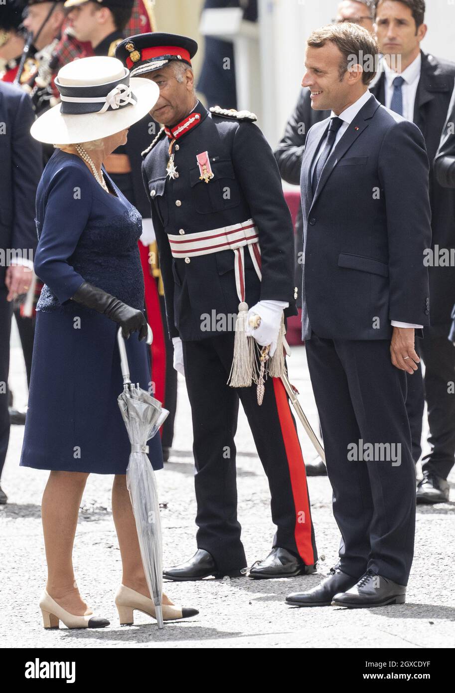 French President Emmanuel Macron meets Camilla, Duchess of Cornwall during a ceremony at Carlton Gardens. The French president is visiting London on June 18, 2020 to commemorate the 80th anniversary of Charles de Gaulle's BBC broadcast to occupied France following the Nazi invasion in 1940 'Appel' . Stock Photo