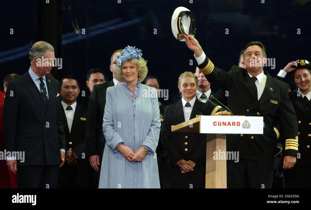 Prince Charles, Prince of Wales and Camilla, Duchess of Cornwall with Captain Paul Wright on stage at the naming ceremony of the Cunard liner Queen Victoria on December 10, 2007 in Southampton. The ship was officially named by the Duchess of Cornwall. Stock Photo