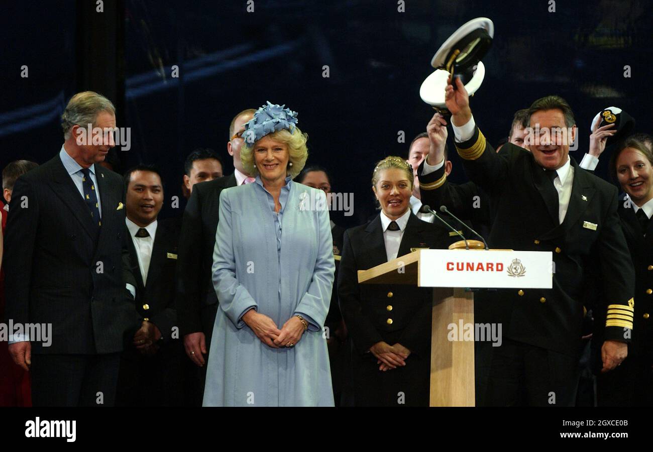 Prince Charles, Prince of Wales and Camilla, Duchess of Cornwall with Captain Paul Wright on stage at the naming ceremony of the Cunard liner Queen Victoria on December 10, 2007 in Southampton. The ship was officially named by the Duchess of Cornwall. Stock Photo